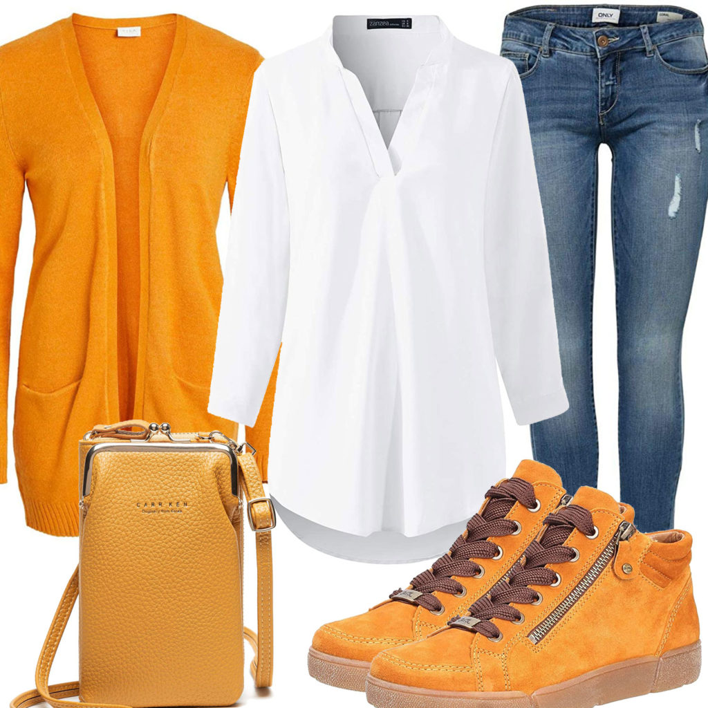 Frauenoutfit mit goldgelber Strickjacke, Sneakern und Tasche
