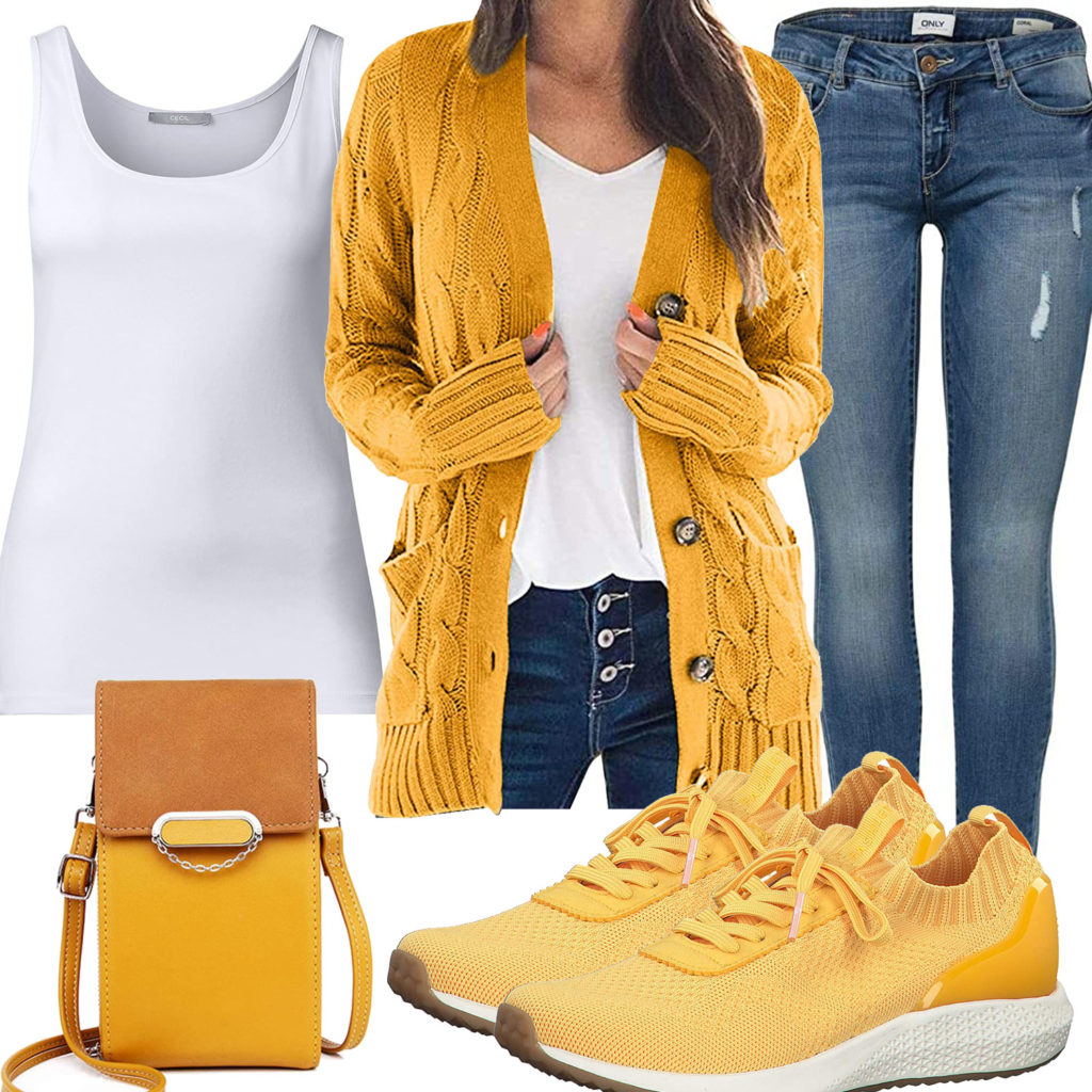 Gelbes Frauenoutfit mit Strickjacke, Sneakern und Tasche